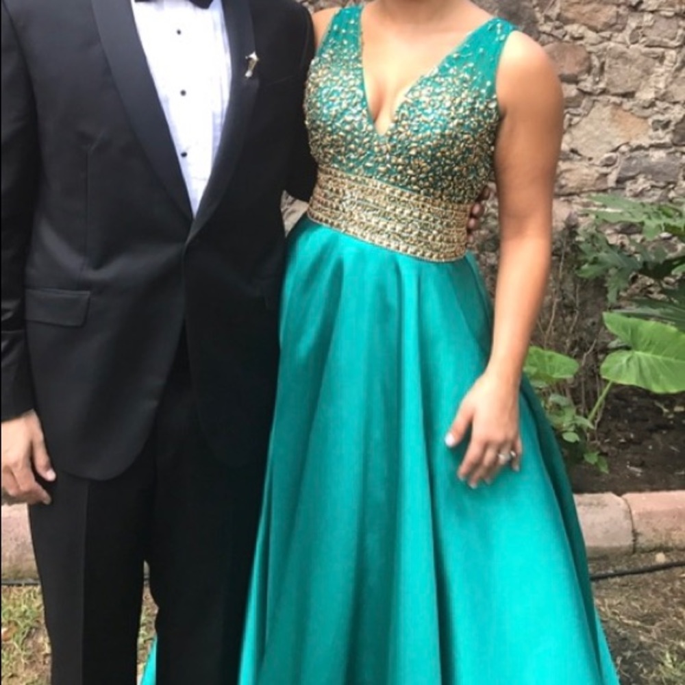 Beautiful emerald prom dress with crystals.